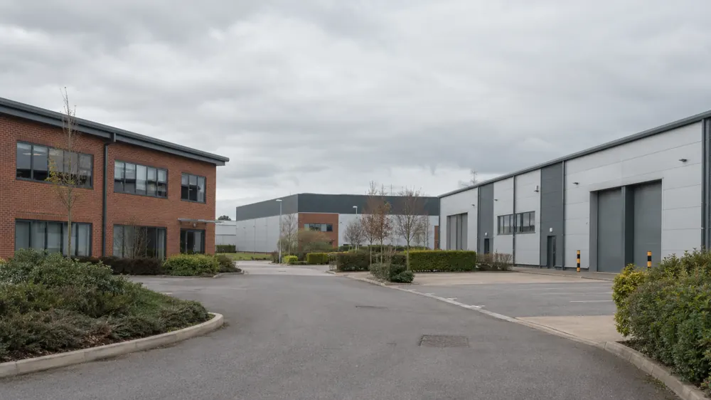 Commercial brick buildings and industrial units, illustrating the type of premises covered